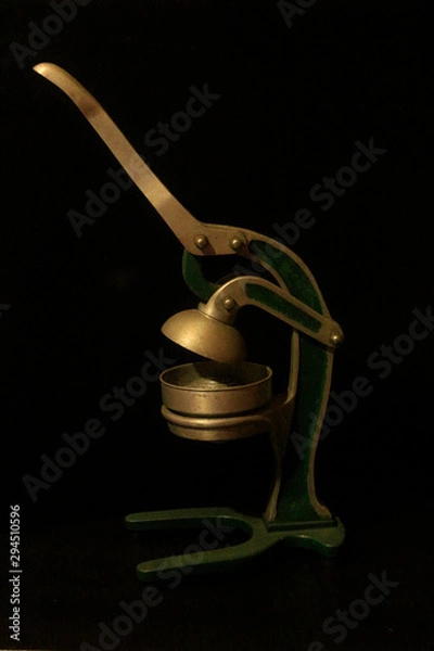 Obraz Old manual metal orange squeezer