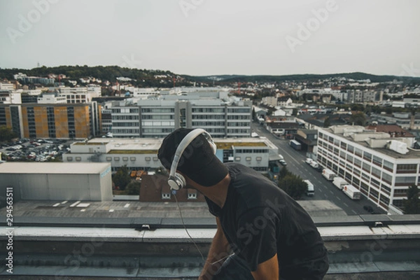 Obraz Man on a roof top of an abandoned building