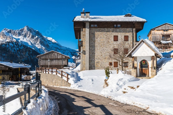 Fototapeta Winter magic. The ancient wooden houses of Sauris di Sopra. Italy