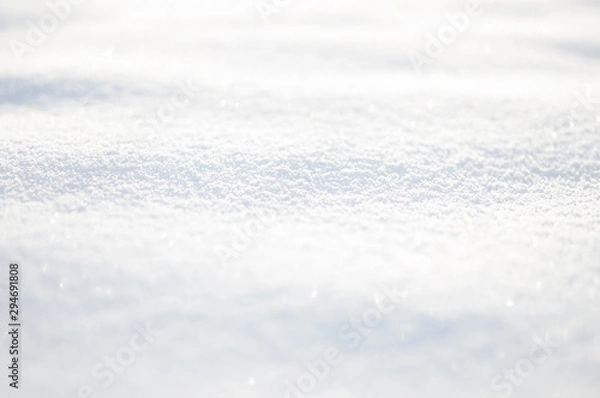 Fototapeta White snow wavy surface close up and flakes background