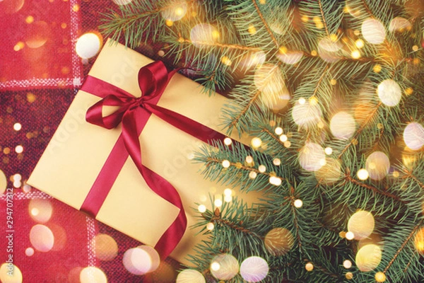 Obraz Christmas gift box under the pine tree