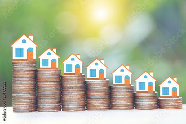 Fototapeta Leadership and teamwork concept, Origami green shirt on growing stack of coins money on natural green background