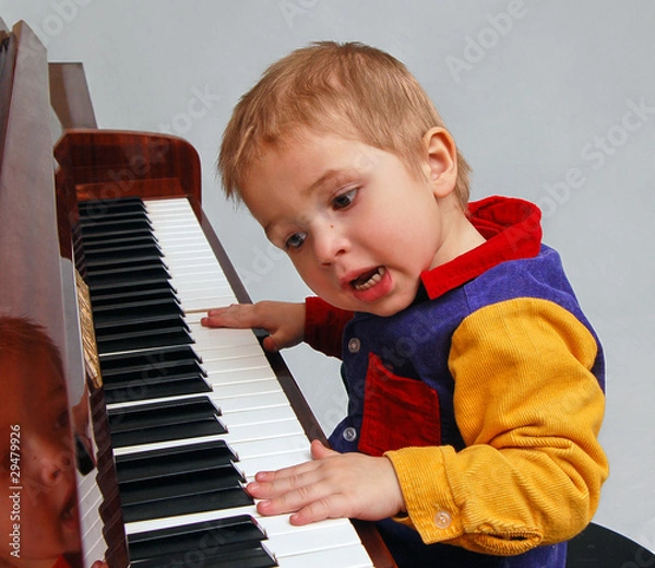 Fototapeta kid playing piano