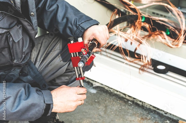 Fototapeta Removing the insulating layer from the cable