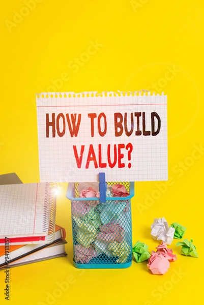 Fototapeta Handwriting text How To Build Value Question. Conceptual photo Ways for developing growing building a business Trash bin crumpled paper clothespin empty reminder office supplies yellow