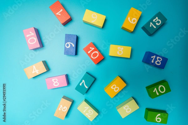 Obraz colored cubes with numbers on a blue background