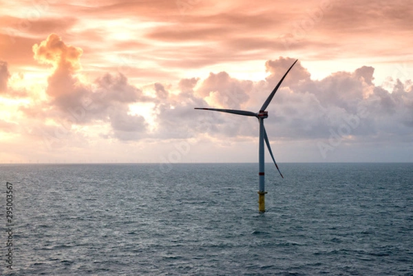 Obraz Sunset over offshore wind farm - green power generation
