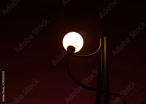 Fototapeta lamp on dark red background