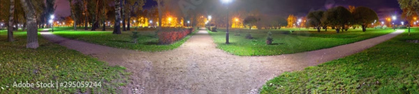 Obraz Fork of three roads at night. Choosing a path in the suburb square.