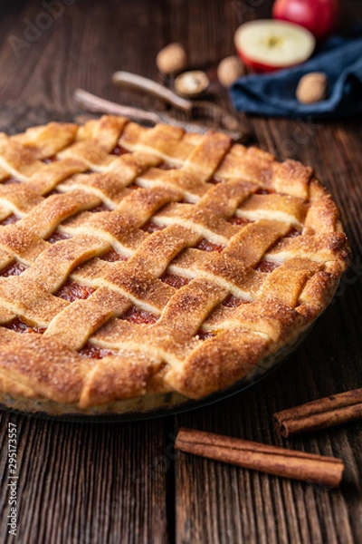 Obraz Homemade dessert, old fashioned lattice crust pie with grated apple and walnut filling, sprinkled with granulated sugar and cinnamon