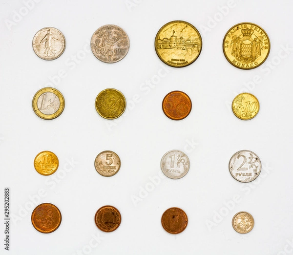 Obraz Set of worn coins of different values and materials, pewter and copper coins of different countries heads and tails, a collection of numismatist souvenir coins of Monaco, Euro, pound, franc, ruble.