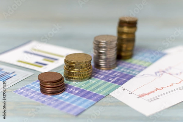 Fototapeta Currency change and piles of coins