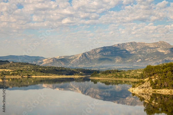 Fototapeta Swamp of Beniarres one day with white clouds reflected in the water.