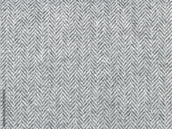 Fototapeta Elegant classic grey woolen fabric. Herringbone tweed, Wool Background Texture. Coat close-up. Expensive men's suit fabric. High resolution