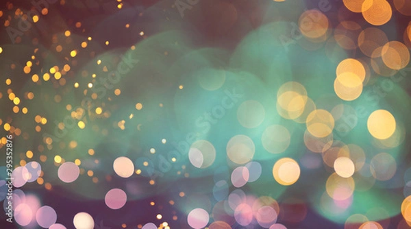 Fototapeta Christmas and New Year holidays background, greeting card. Glitter lights backdrop. Winter season. Text space.
