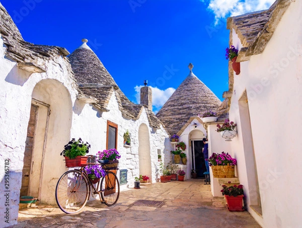 Fototapeta Alberobello, Puglia, Italy: Typical houses built with dry stone walls and conical roofs
