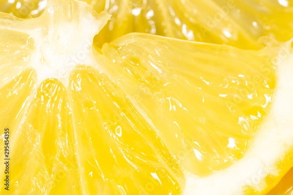 Fototapeta Fresh juicy yellow lemon as an abstract background