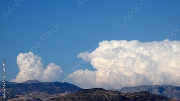 Obraz Large white cloud against blue sky