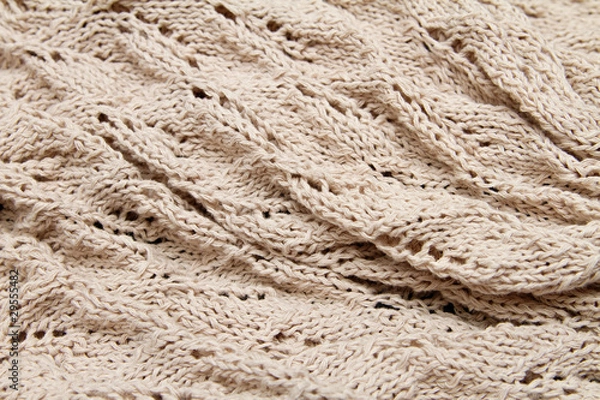 Obraz a beige knitted fabric. a close up.