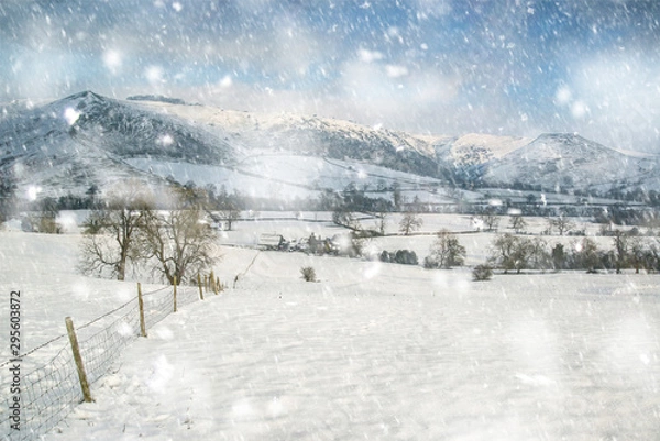 Fototapeta Beautiful snow covered Winter landscape at sunrise in Peak District in England in heavy snow storm