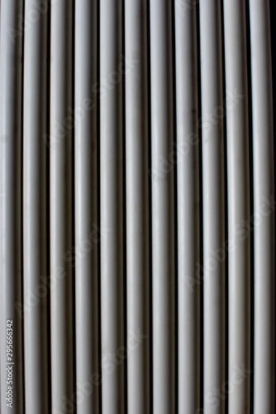 Fototapeta White water pipes arranged in a pattern