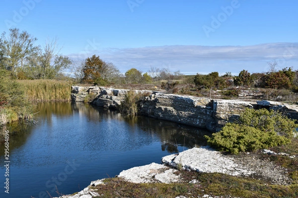 Obraz Lake with cliffs by an old limestone quarry