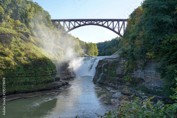 Fototapeta Upper falls at the Letchworth State Park located in New York. Arched bridge, railroad tracks above the falls.