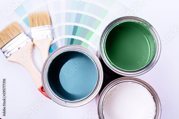 Fototapeta brushes and an open can with red on a plain gray background