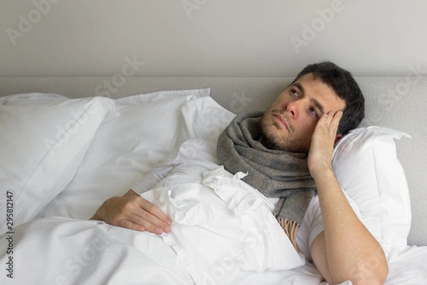 Obraz Man feeling bad lying in the bed
