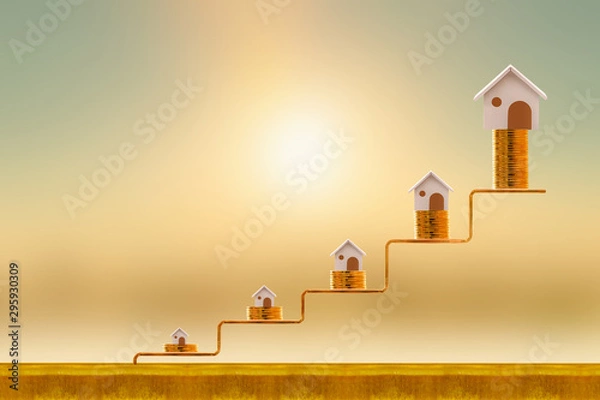 Obraz Stacking five gold coin with growing on golden steps and home as destinations on sunlight background, Loan for real estate or buy a new house in the future concept.