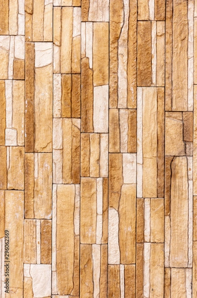 Fototapeta Tile stone wall pattern texture. For background or floor. Fragment of a wall from a chipped stone