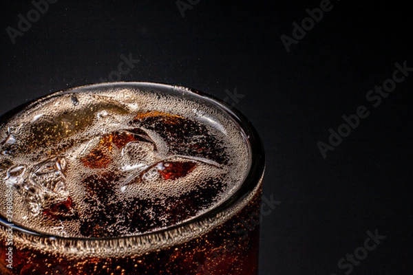 Fototapeta Fizz sparkling Cola water Refreshing bubbly Soda Pop with Ice Cubes. Cold soft drink cola carbonated liquid fresh and cool iced drink in a glasses . Refreshing and quench thirst concept .
