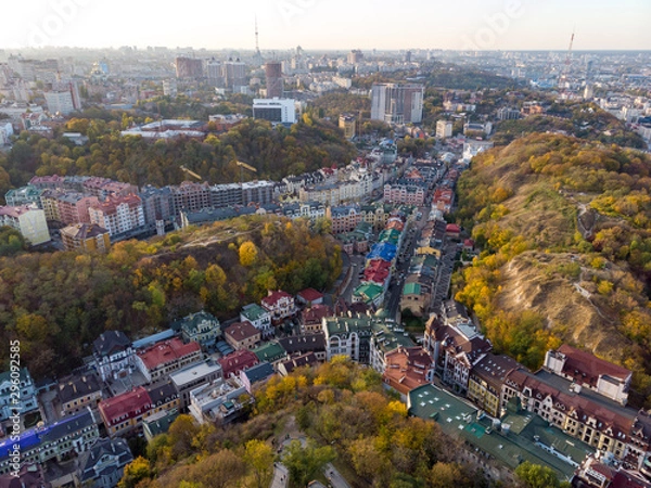 Obraz Aerial top view of Kyiv cityscape of Vozdvizhenka and Podol historical districts on sunset from above, city of Kiev, Ukraine