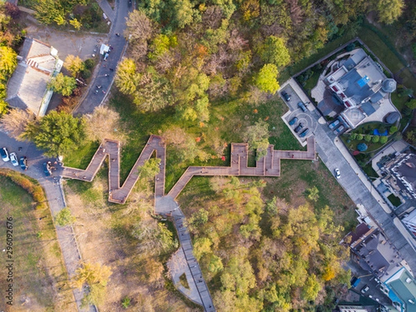 Obraz Aerial top view of Kyiv cityscape of Vozdvizhenka and Podol historical districts on sunset from above, city of Kiev, Ukraine