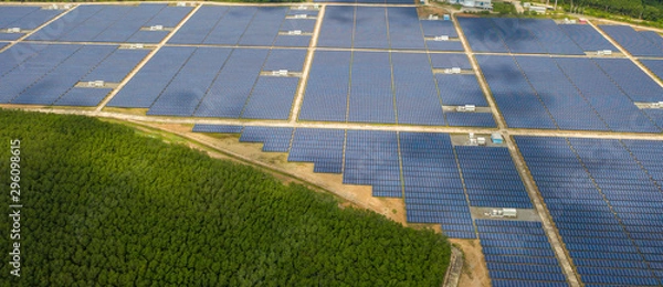 Obraz Aerial view ,Solar power plants have clouds moving through and sunlight shines. Banner background