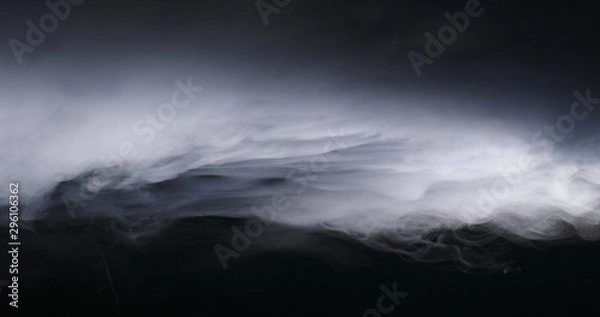 Fototapeta Realistic dry ice smoke clouds fog overlay perfect for compositing into your shots. Simply drop it in and change its blending mode to screen or add.