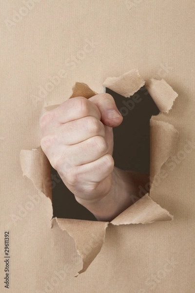 Obraz eine Faust durchschlägt eine Papierwand