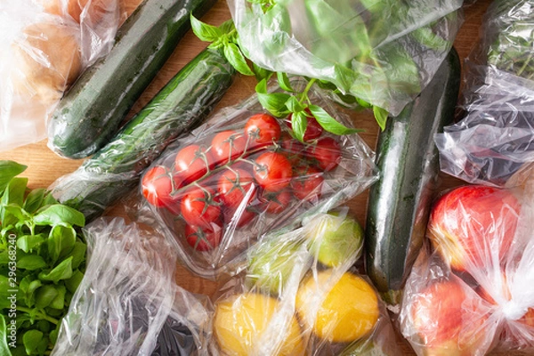 Fototapeta single use plastic waste issue. fruits and vegetables in plastic bags