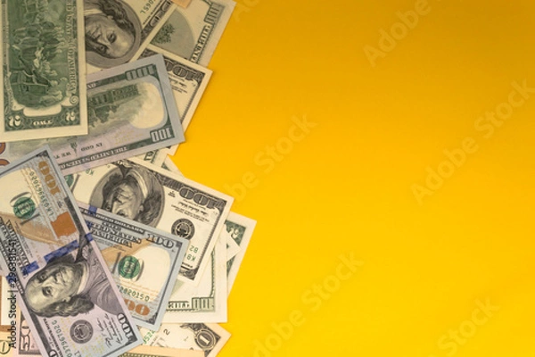 Fototapeta One hundred dollar banknotes on colored background top view, with empty place for your text business money concept.