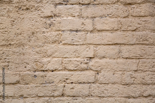 Obraz old gray beige brick wall with damaged cement. rough surface texture