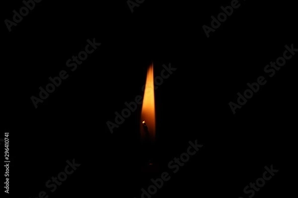 Obraz Candle flame in black background