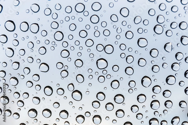 Fototapeta Water droplets on the glass during the rainy season. Copy space background and select focus