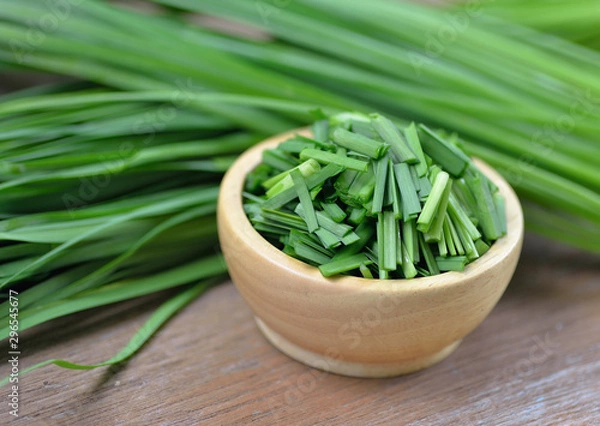Obraz beautiful green onion chives on background.