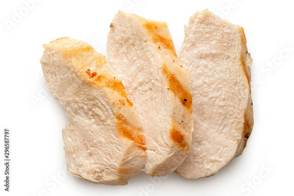 Obraz Three slices of grilled chicken breast with grill marks isolated on white. Top view.