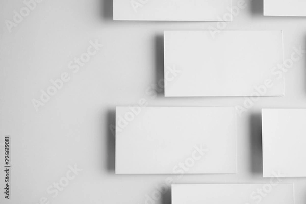 Fototapeta Blank business cards on white background, top view. Mock up for design