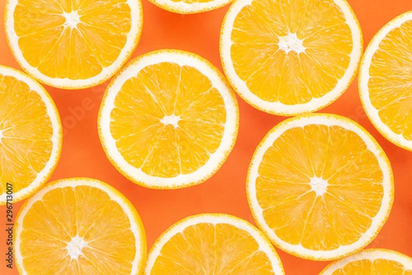 Fototapeta slices of orange isolated on orange background