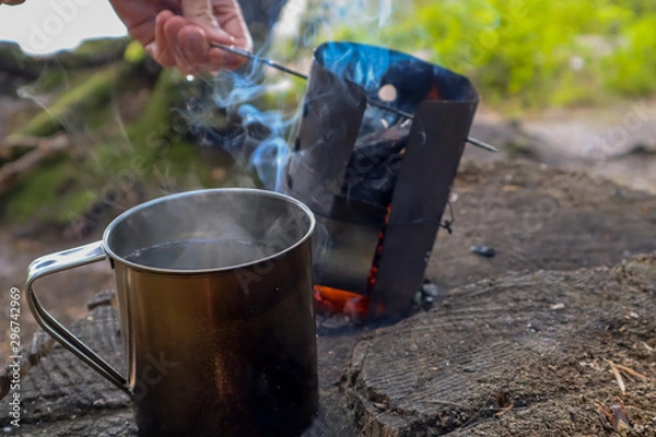 Fototapeta A stove is a grate, how to cook on fire and drink tea on nature. The smoke smacks him with a special scent and charm.
