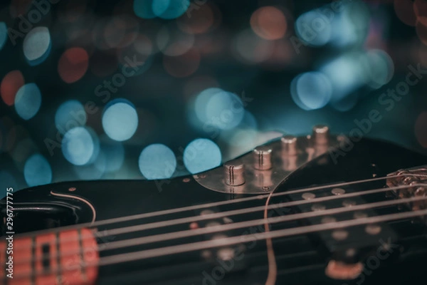 Obraz Electric bass guitar blurred background with beautiful bokeh.