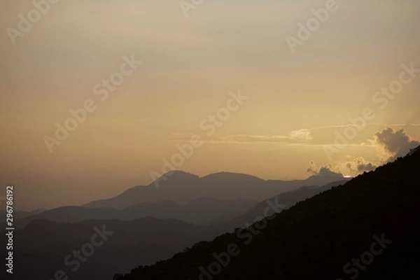 Fototapeta dramatic sunset in mountains of dominican republic with a sliver of sunshine