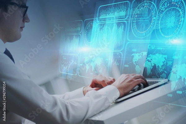 Fototapeta Programmer with laptop in office, HUD interface